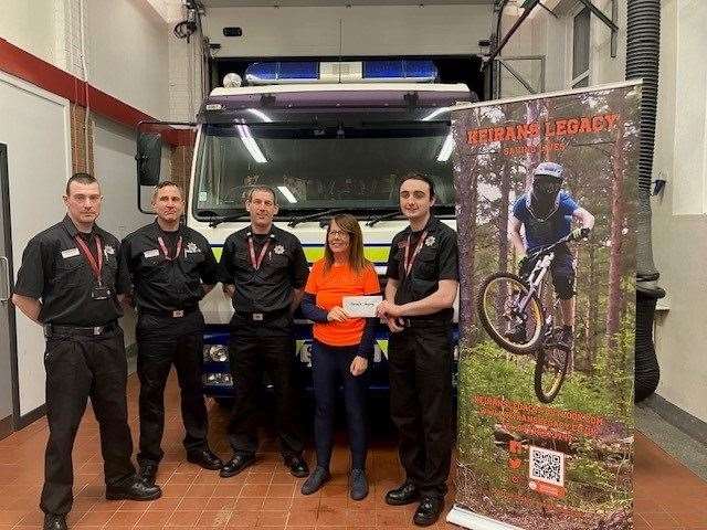 Sandra McKandie accepts a cheque on behalf of Keiran's Legacy from Firefighter Brennan Dawson. They are joined by (from left) Firefighters Stephen Murray and Paul Whibley as well as Crew Commander John Jappy. Picture: Cullen fire station