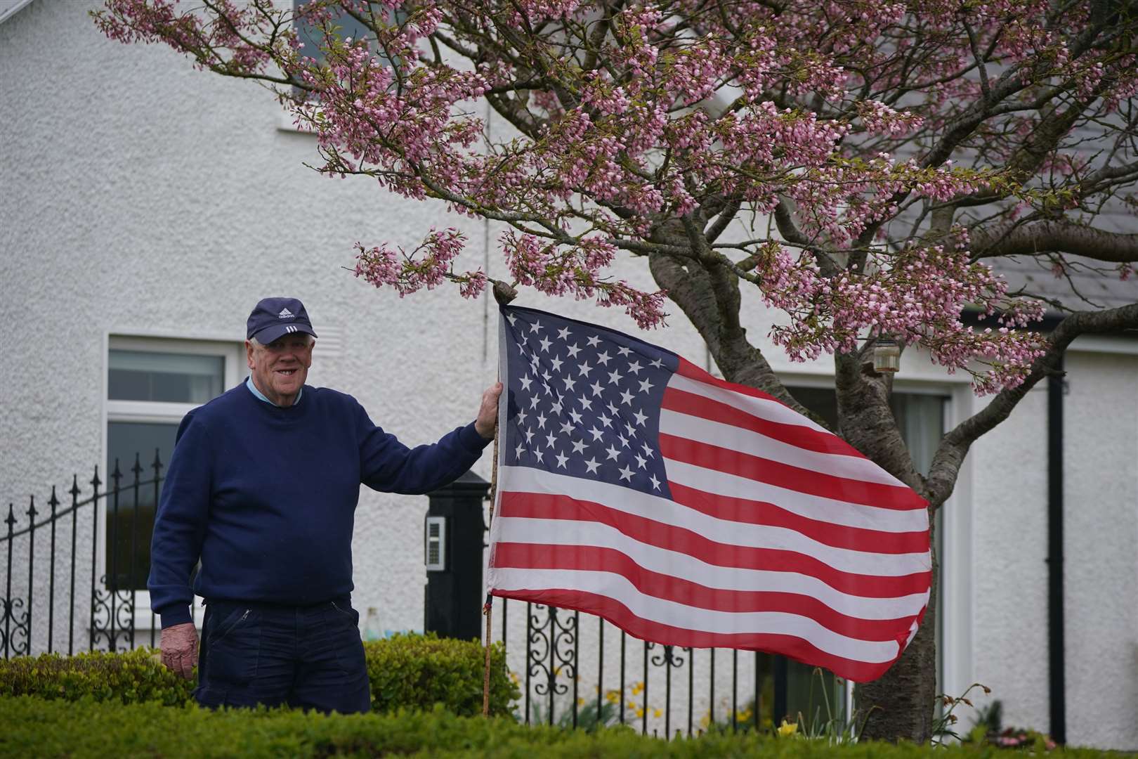 Ambrose Carroll flies an American flag in his garden in Whitestown, near Carlingford in Co Louth, close to Kilwirra Cemetery (Niall Carson/PA)