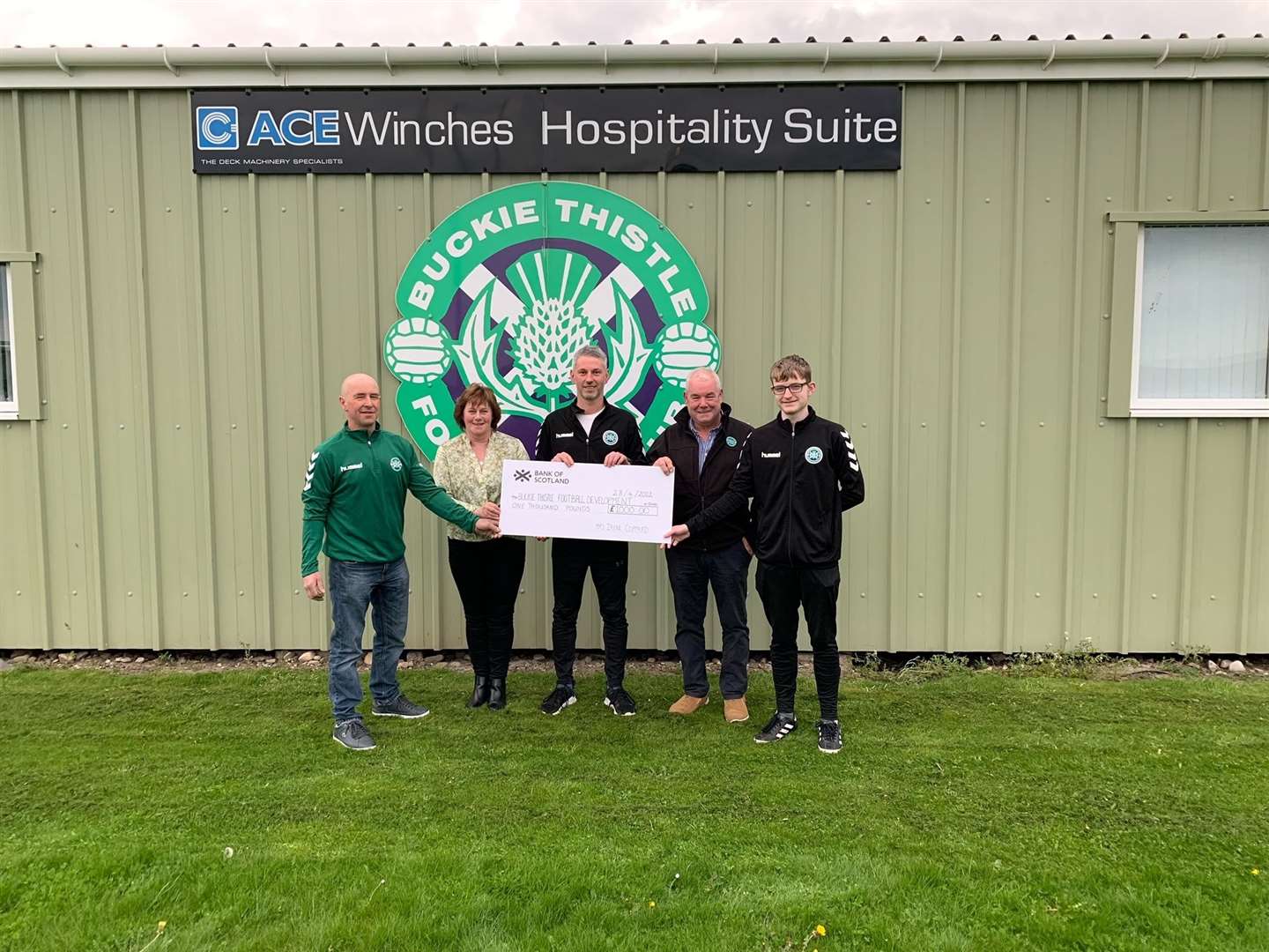 Fiona Walls, along with husband Eadie (second right) present a cheque for £1000 to Under-18s manager Graham Hutcheson (left), Under-14s manager Mark Graham (centre) and Under-18s assistant manager Rhys Owen. Picture: BTYD
