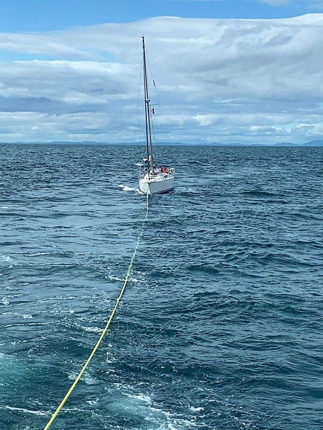 The Buckie RNLI lifeboat crew establish a tow to the yacht. Picture: Buckie RNLI