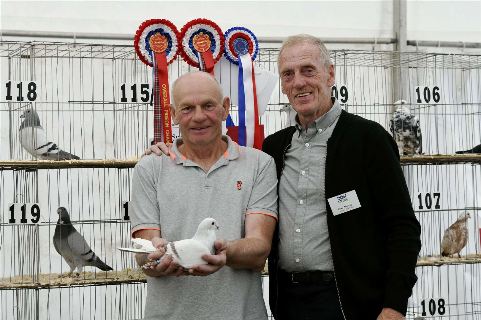 Evan Murray (right) and Martin Ross (left) with the overall winner of the Pigeon section. ..Turriff Show 2022...Picture: Beth Taylor.