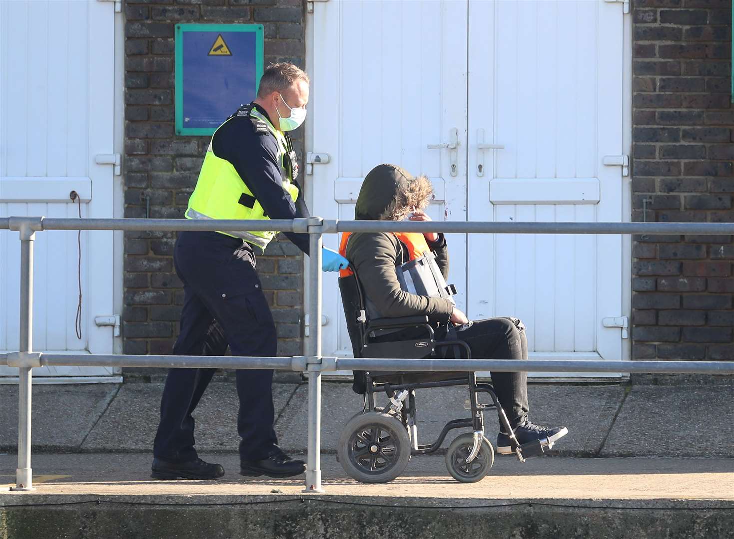 One man arriving at Dover was helped into a wheelchair by officials (Gareth Fuller/PA)