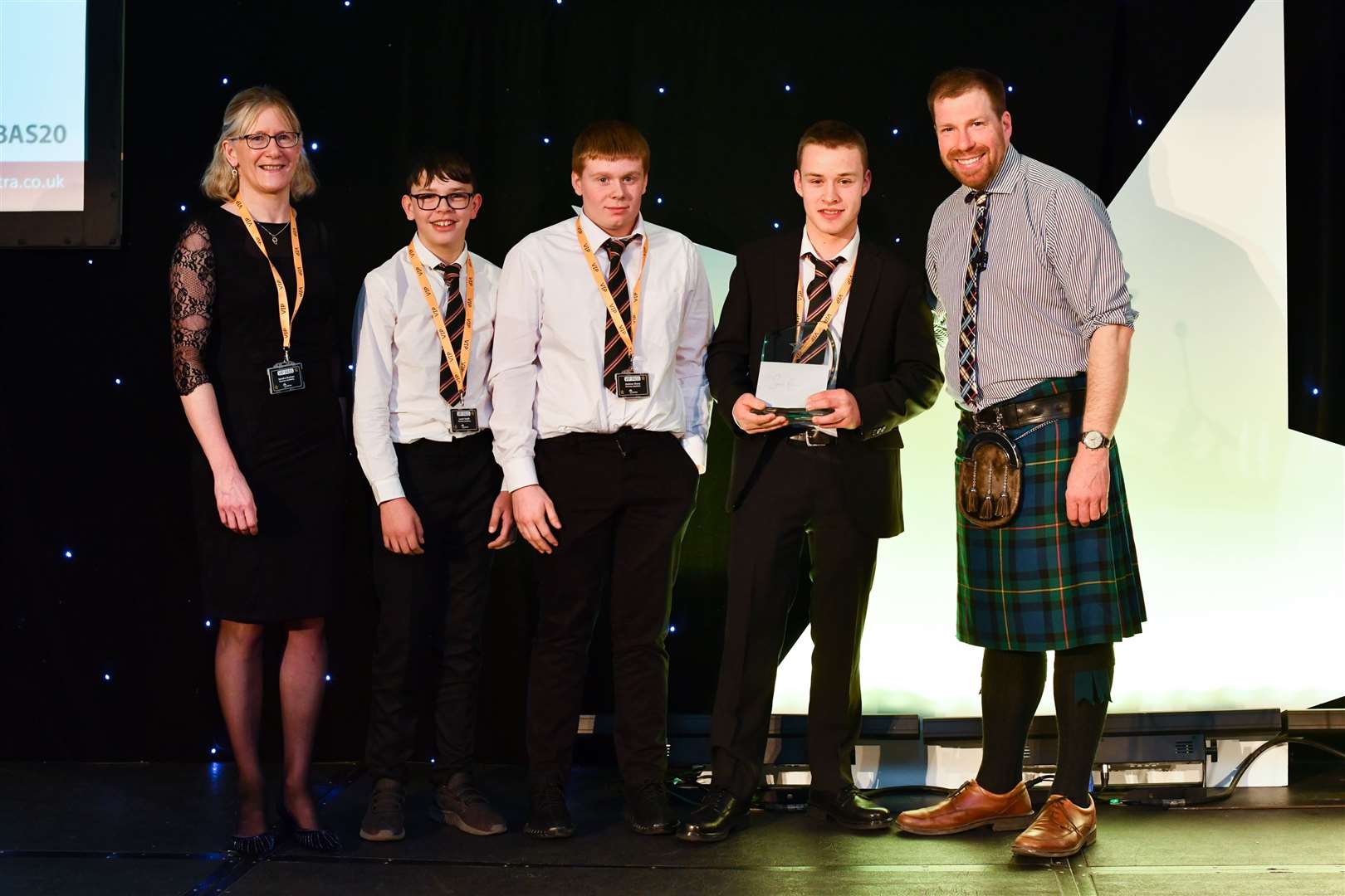 Kemnay Academy's Sandra Buchan with pupils XYZ and host Jim Smith at the Lantra Scotland ALBAS Awards
