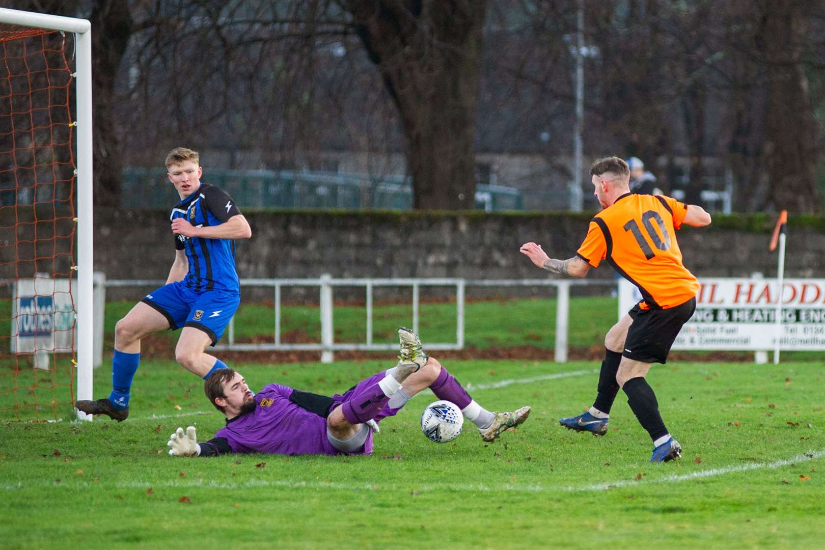Huntly goalkeeper Euan Storrier pulls off a succession of good saves to deny Alisdair Sutherland a goal for the home side...Rothes FC (1) vs Huntly FC (0) - Highland Football League - Mackessack Park , Rothes 28/11/2020...Picture: Daniel Forsyth..