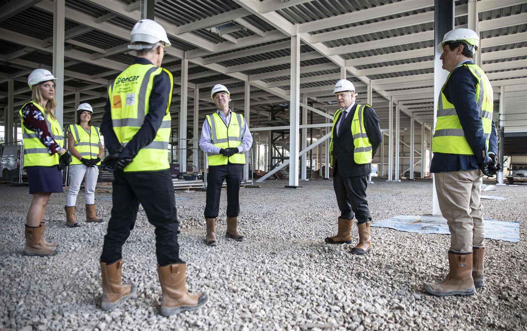 Prime Minister Boris Johnson talks with scientists as he visits the construction site (Richard Pohle/The Times)