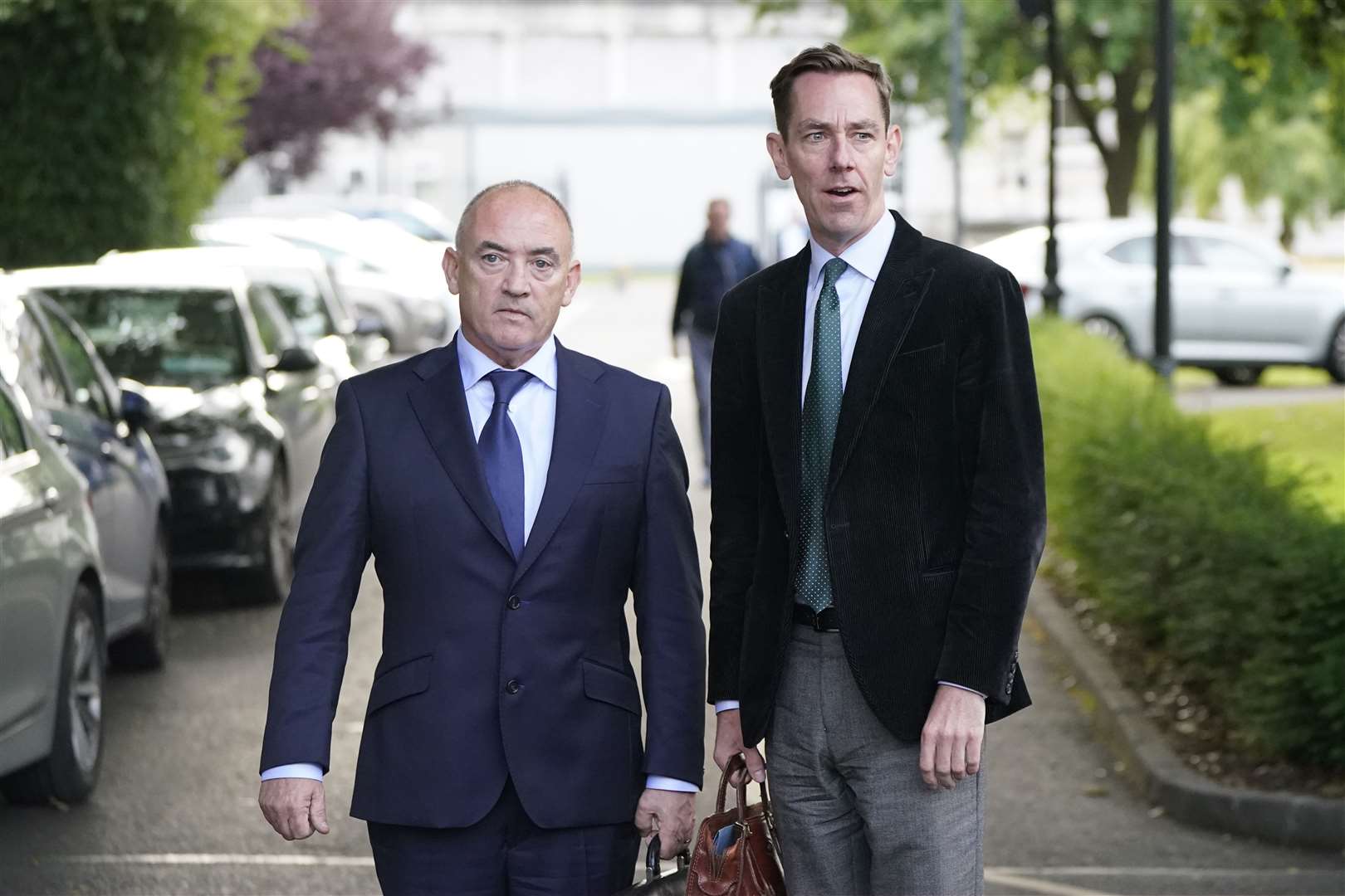 Talent agent Noel Kelly with his client Ryan Tubridy leaving Leinster House after a parliamentary committee hearing into the controversy (Niall Carson/PA)