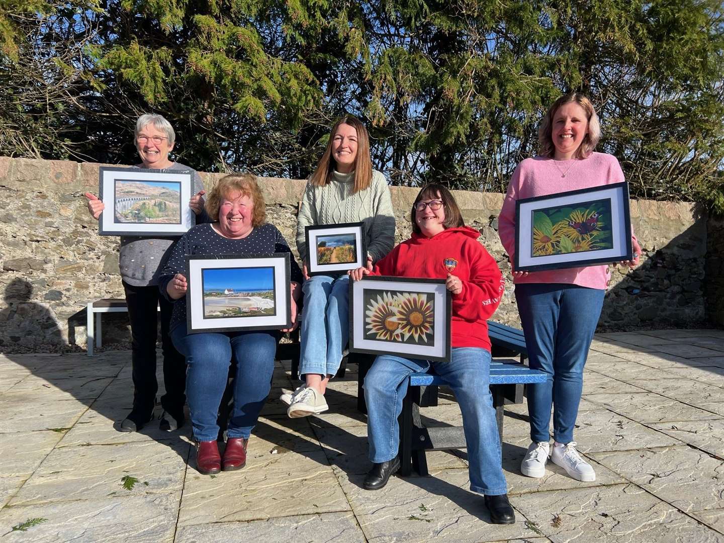 This year's photo competition winners with their prints. Picture: Phul Harman