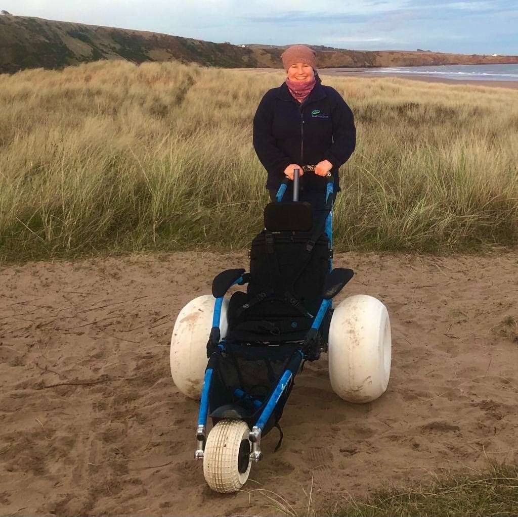 NatureScot's Therese Alampo with one of the all-terrain beach wheelchairs which will be based at St Cyrus National Nature Reserve.