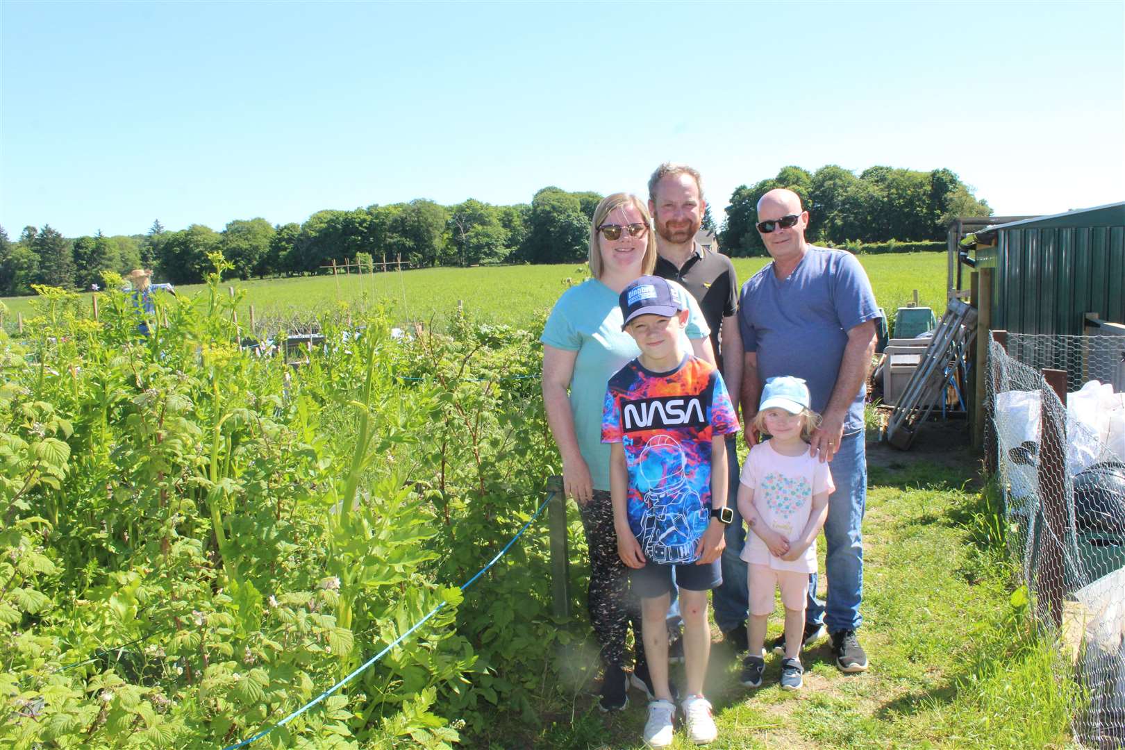 Visitors to the Mens Shed allotments Open day, granddad Charlie Mennie, Mike King, Leanne King with would-be gardeners Blair and Megan found plenty to interest them on their walk-about at Souterford on Saturday. Picture: Griselda McGregor