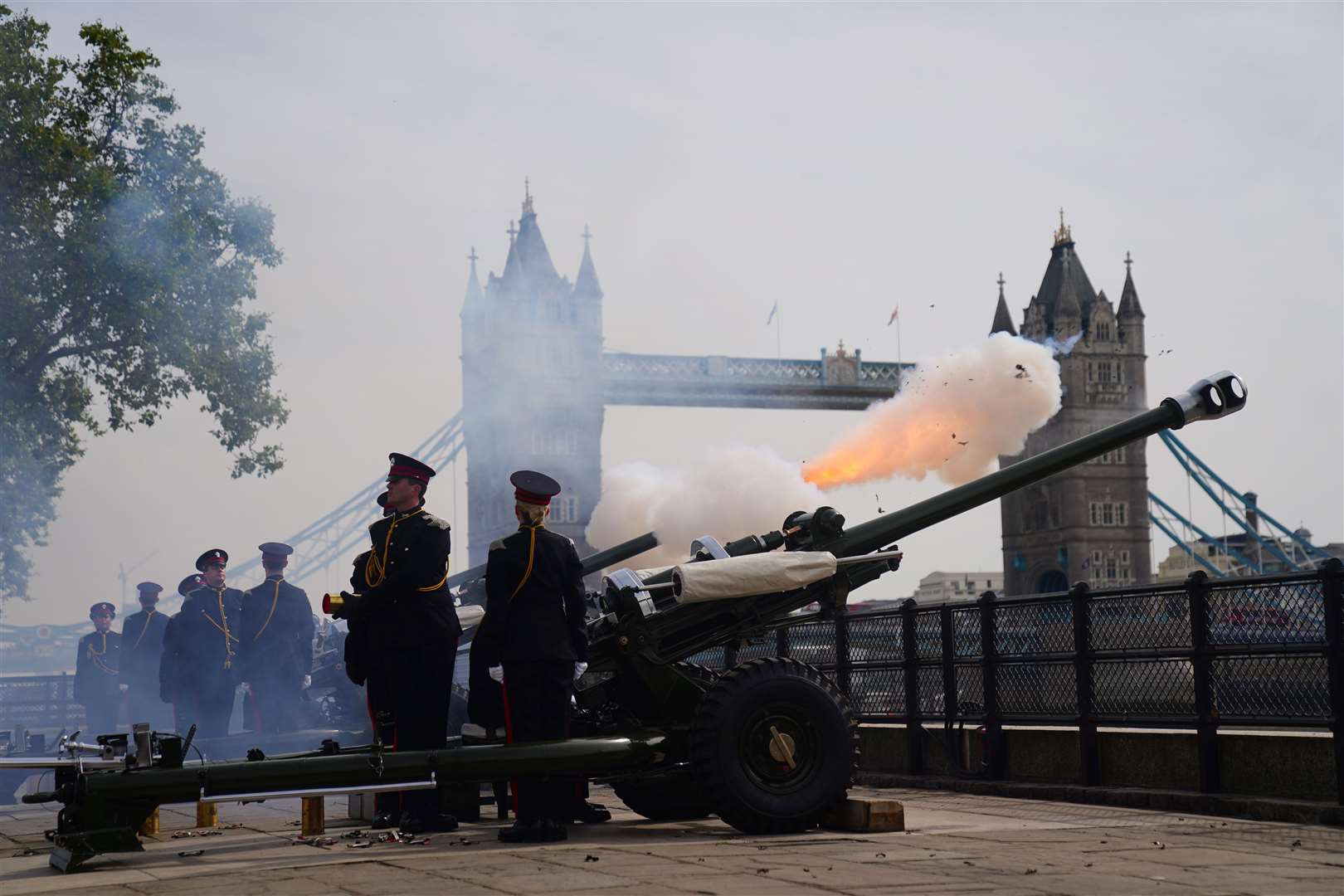 Members of the Honourable Artillery Company fire a royal gun salute at the Tower of London to mark Accession Day, the first anniversary of the King’s accession to the throne, and to mark the first anniversary of the death of Queen Elizabeth II (Victoria Jones/PA)