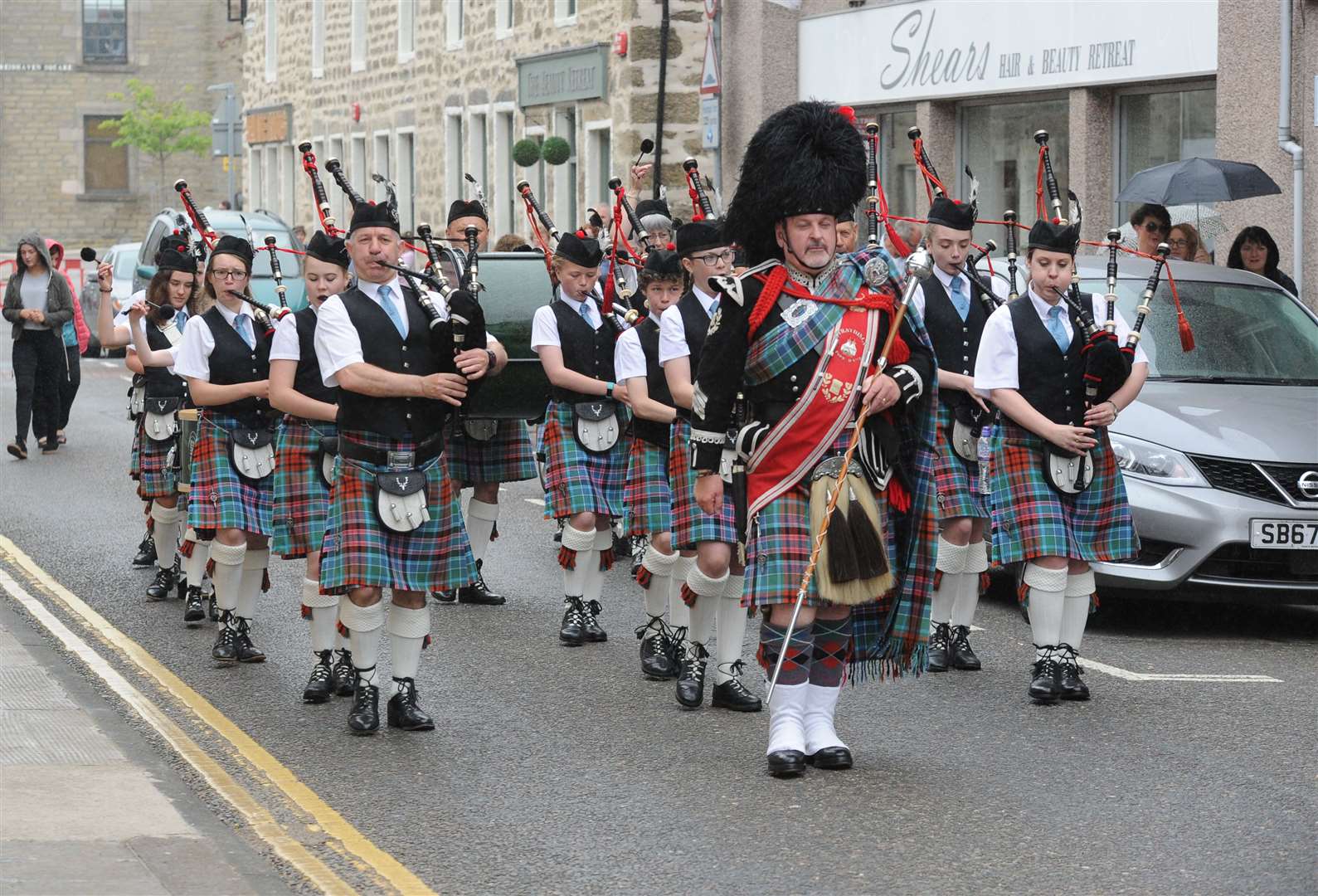 Strathisla Pipe Band march down Mid Street during the 2018 gathering.