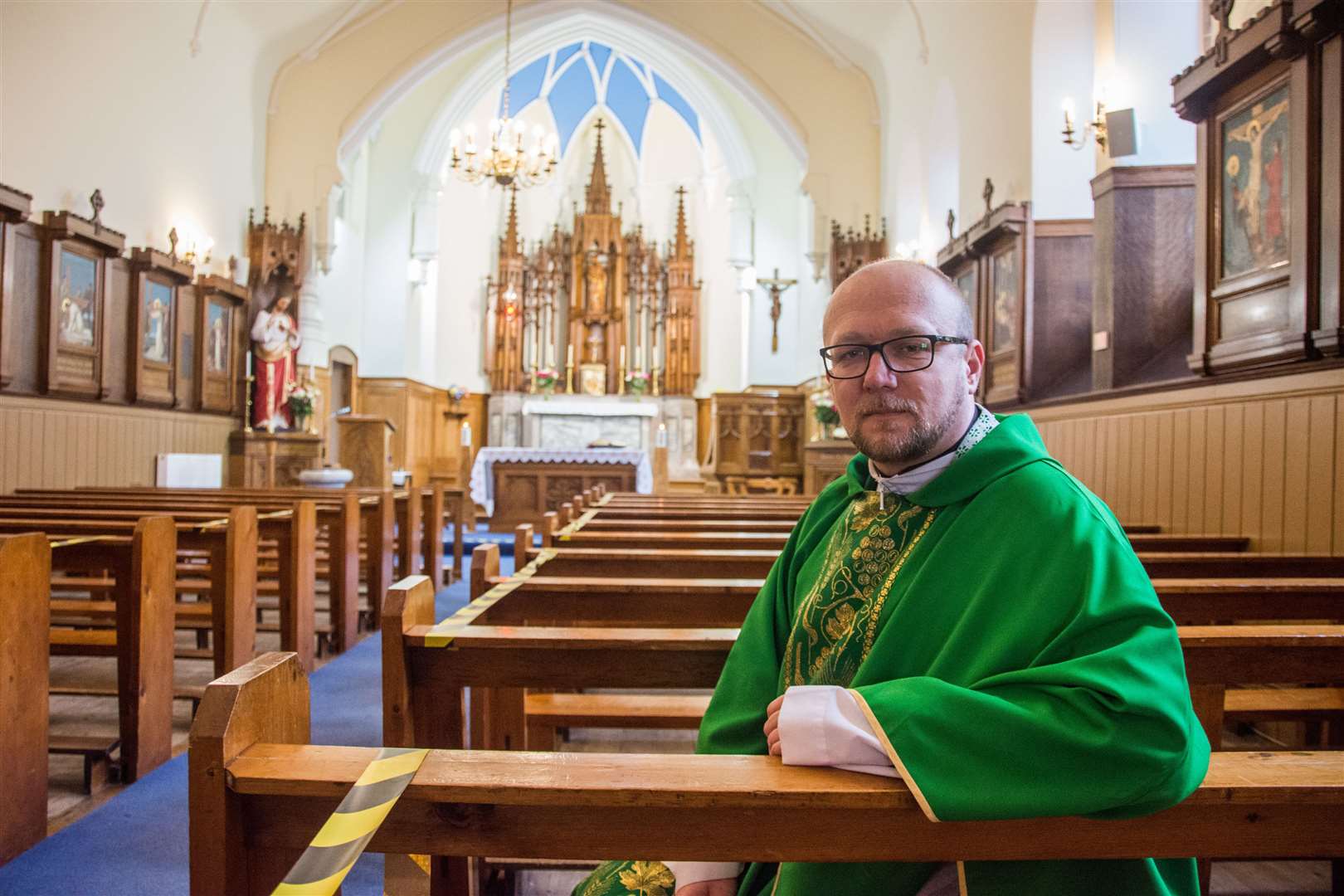 Father Piotr Rytel in the pews of the revamped Our Lady of Mount Carmel RC Church, on Sandyhill Road, Banff. Picture: Becky Saunderson.
