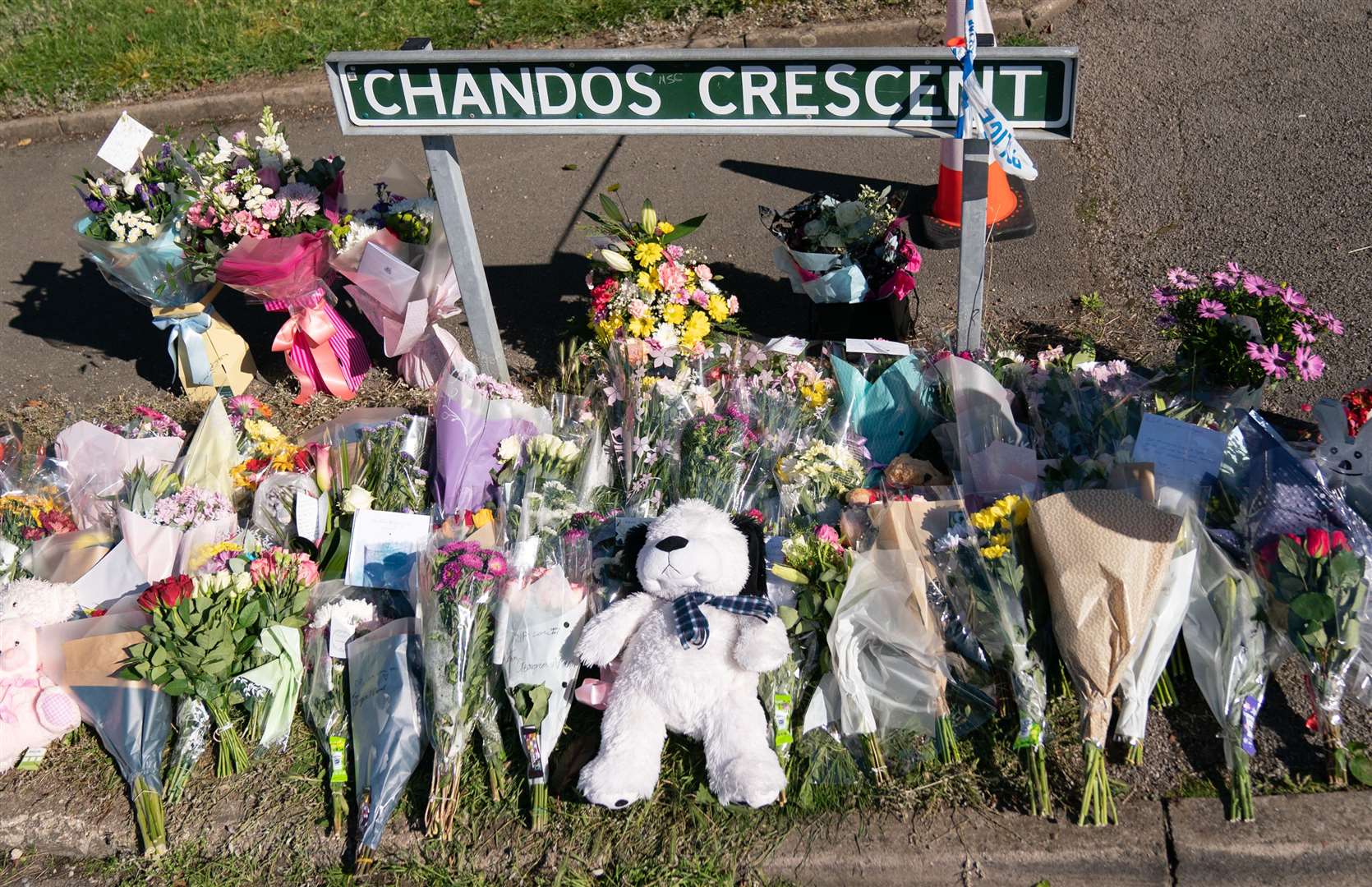 Floral tributes at the scene in Chandos Crescent in Killamarsh (Danny Lawson/PA)