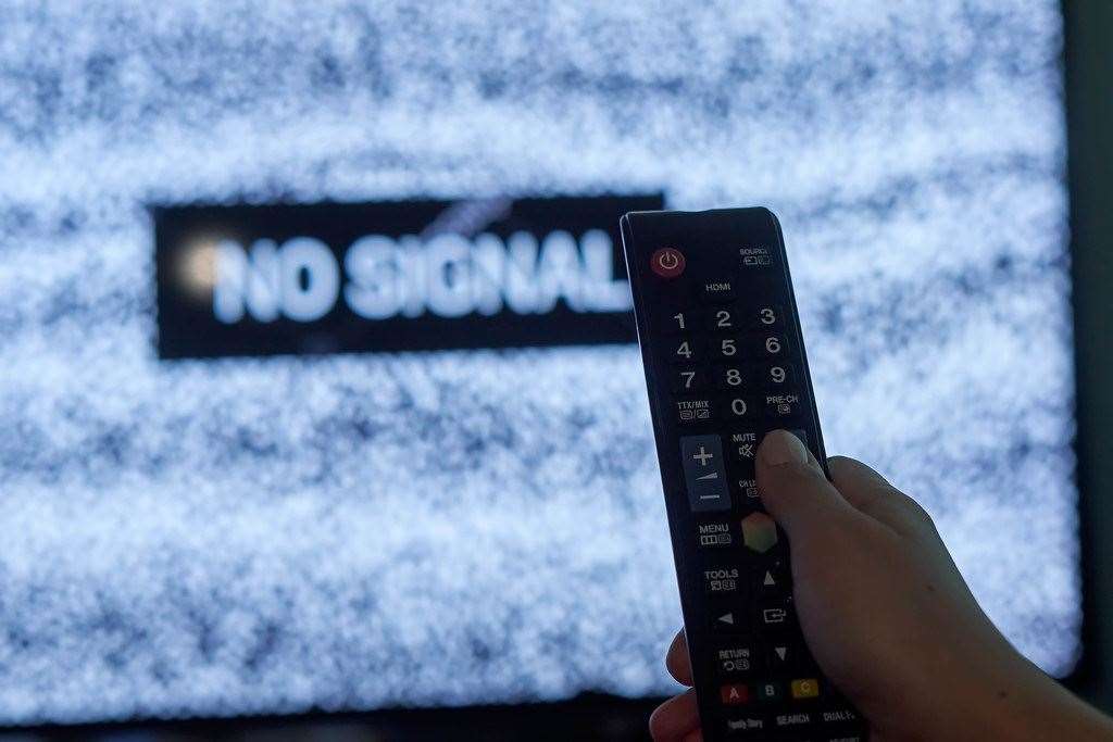 Symptoms of interrupted TV signal could include pixelated images and a complete loss of signal.
