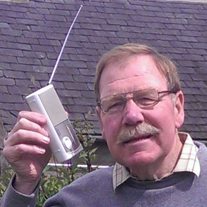 John, pictured here with an old transistor radio, was affectionately known as 'The Manny on the Tranny'.