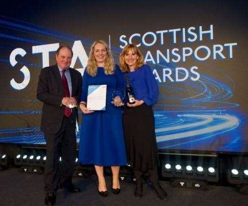 BBC News special correspondent James Naughtie presents Aberdeenshire Council transportation strategy development officer Claire Maycock and chief executive of Greener Journeys Claire Haigh with the award.