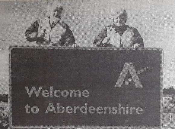 Colin Millar and Audrey Findlay put up one of the new Aberdeenshire signs