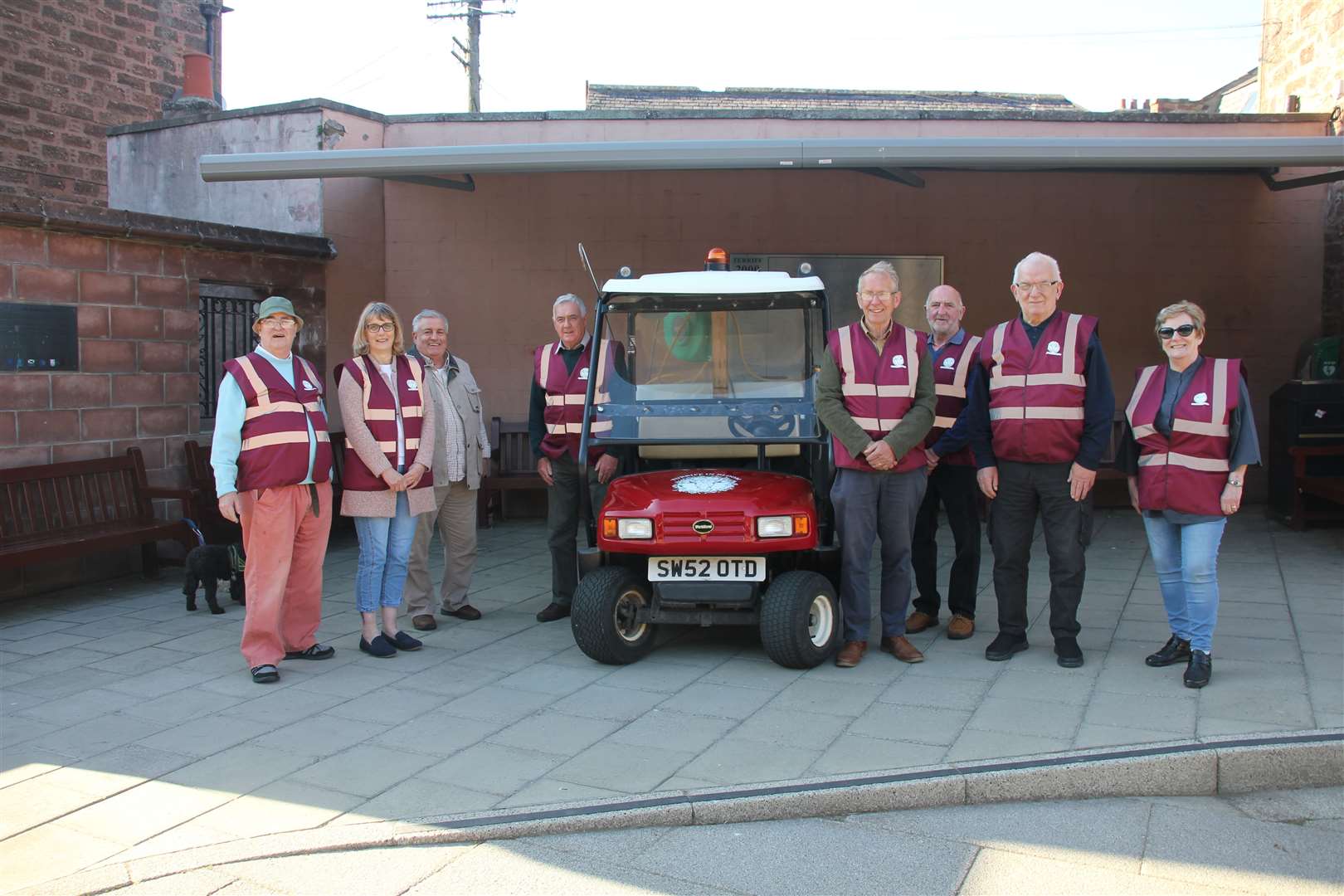 Turriff In Bloom volunteers show off their new water caddy and vests. Picture: Kirsty Brown