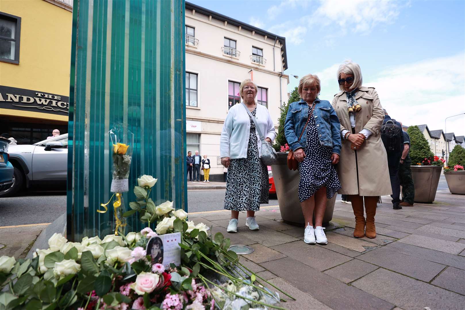 Ann Wilson, centre, whose daughter Lorraine died in the Omagh bombing and Caroline Martin, right, whose sister Esther Gibson was also killed, mark the 25th anniversary of the Real IRA atrocity (Liam McBurney/PA)