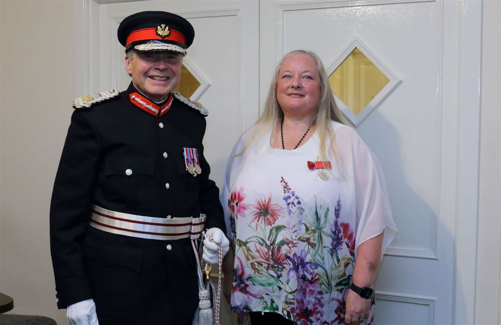 The British Empire Medal was presented to Morag Lightning by Lord Lieutenant of Aberdeenshire, Sandy Manson.