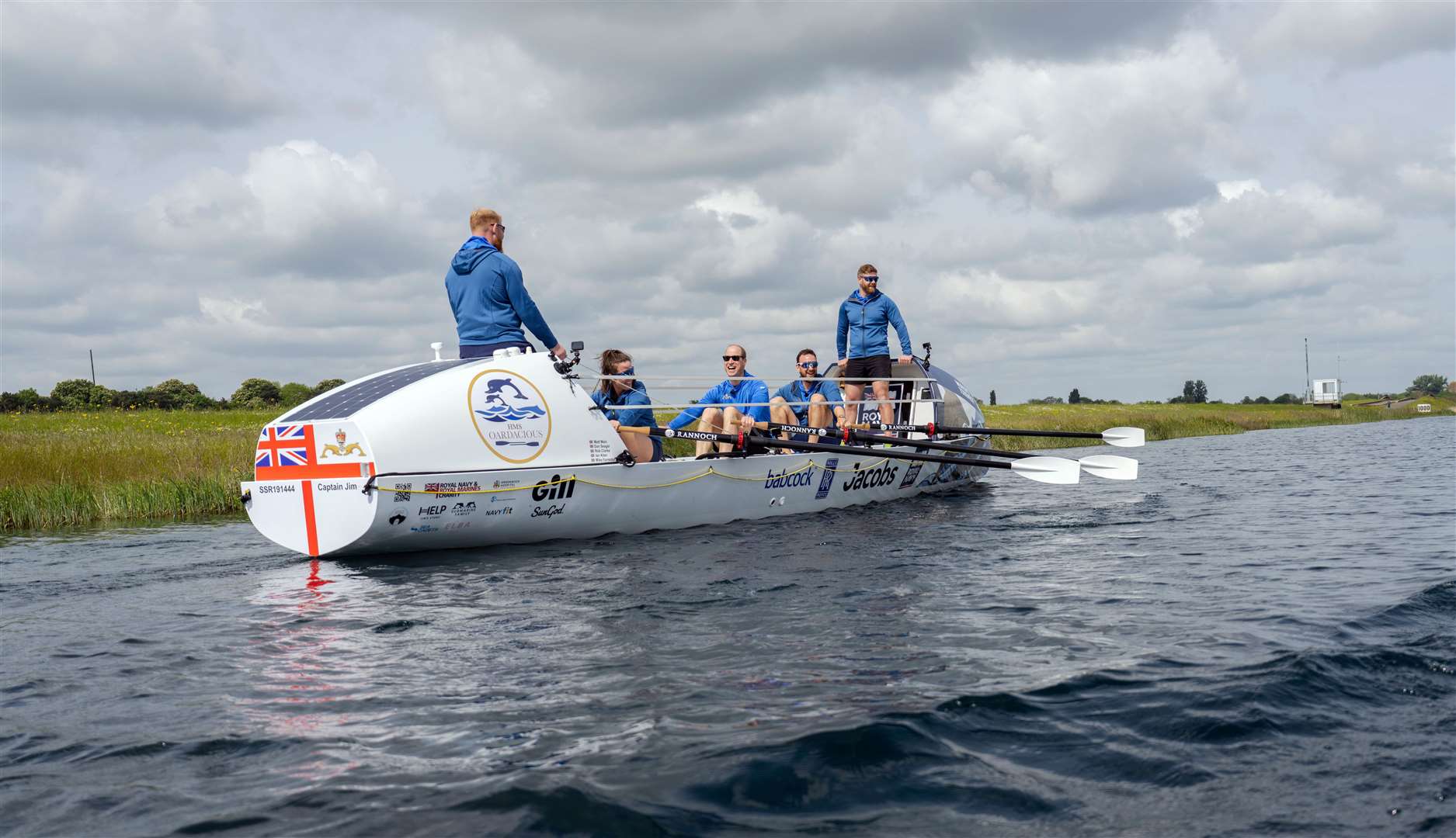 The Prince of Wales with members of the HMS Oardacious crew as they took part in a training session on Dorney Lake, Windsor in Buckinghamshire (Kensington Palace Copyright: The Prince and Princess of Wales/PA)