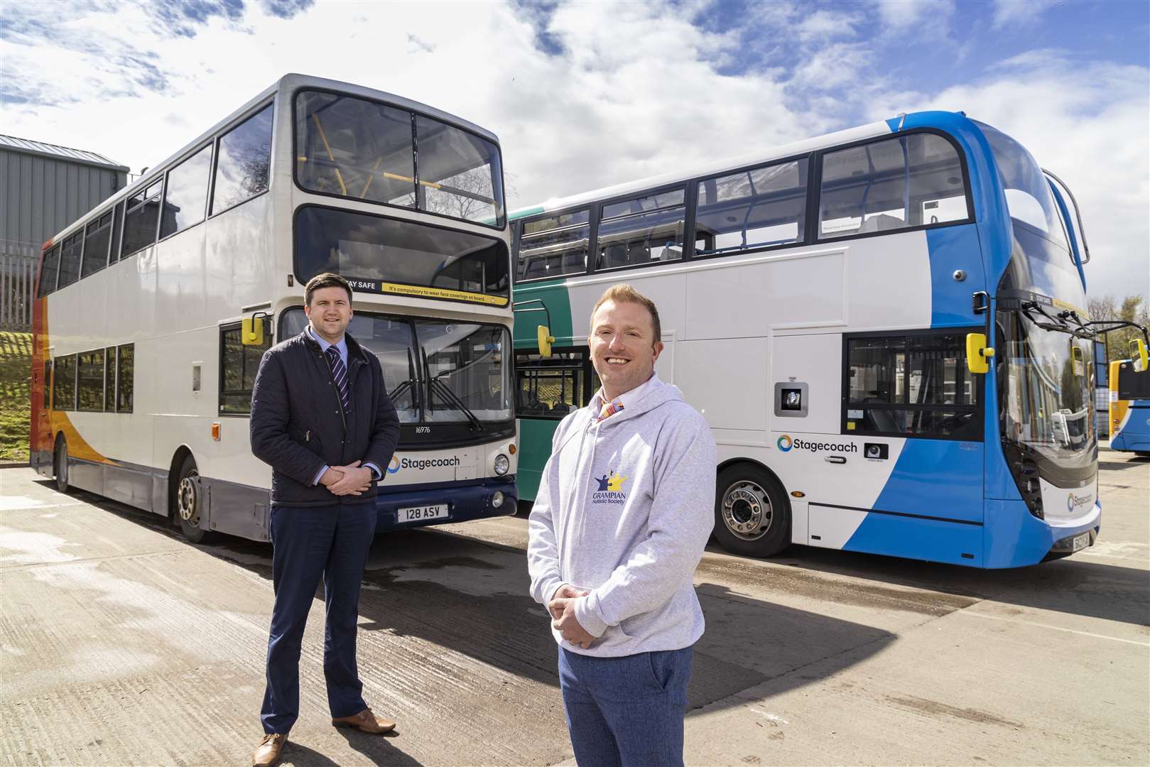 Managing director of Stagecoach Bluebird, Peter Knight, and Billy Alexander, CEO of Grampian Autistic Society.