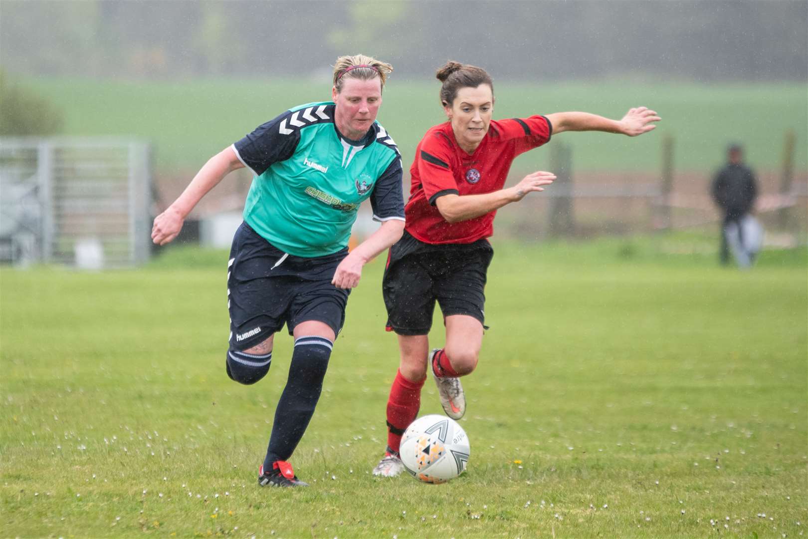 Buckie Ladies' Alicia Paterson and Brora's Melissa Fox chase down the ball...Buckie Ladies FC (8) vs Brora Rangers Ladies FC (1) - SWF Highlands and Islands League - Gordon Park, Portgordon 14/05/2023...Picture: Daniel Forsyth..