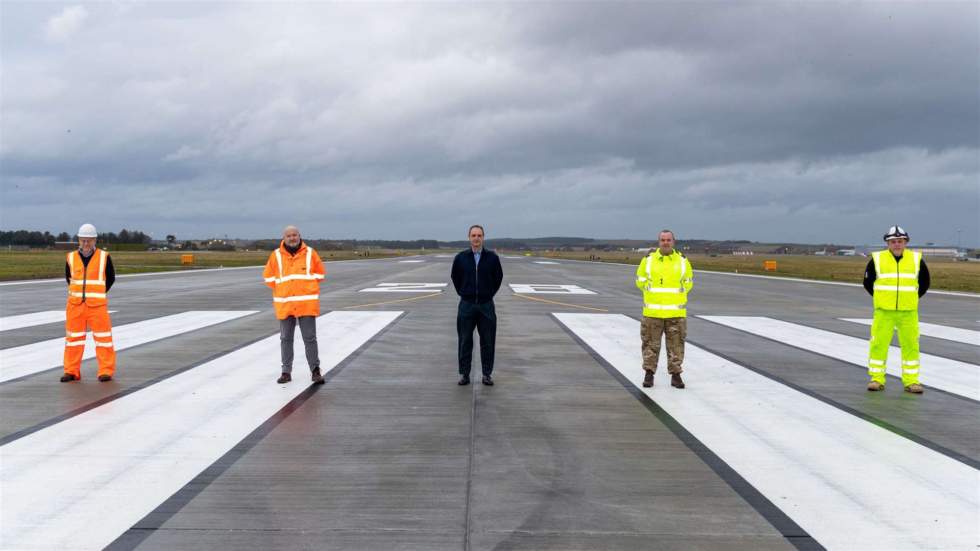 Representatives from DIO, VolkerFitzpatrick and RAF Lossiemouth mark the handover of the completed runway, (from left) Keith Mablethorpe, VolkerFitzpatrick project director, Russ Liddington, DIO project manager, Wg Cdr James Ash, RAF Lossiemouth, Wg Cdr Pete Beckett, Lossiemouth Development Project, and Andy Reynolds, VolkerFitzpatrick operations manager. Picture: Crown Copyright, 2020