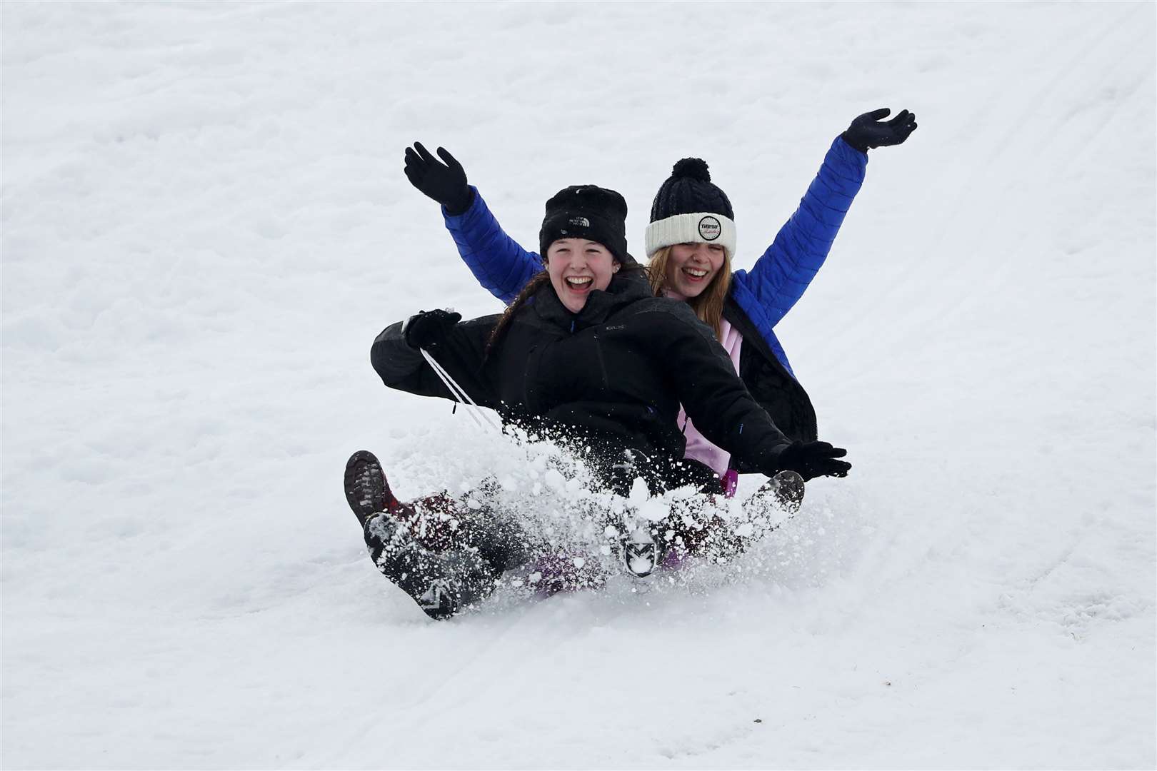 Emma McPartland (front) and Hannah Coulthart sledging on the golf course at Gleneagles in Auchterarder, Perthshire (Andrew Milligan/PA)