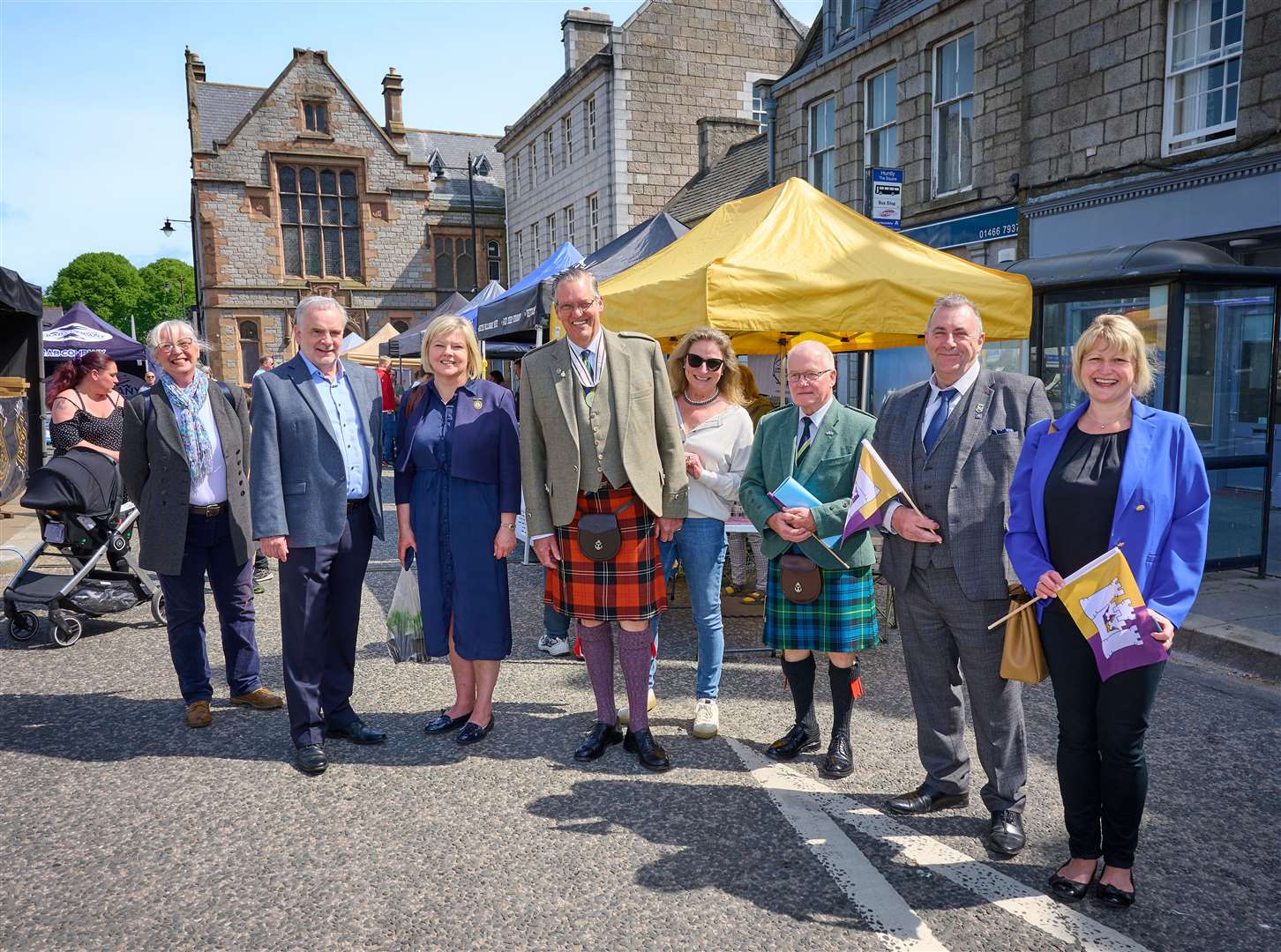 Special guests including Deputy Lord-Lieutenant Major Grenville Irvine-Fortescue witnessing Huntly's first taste of the new flag...Picture: Dave Simpson