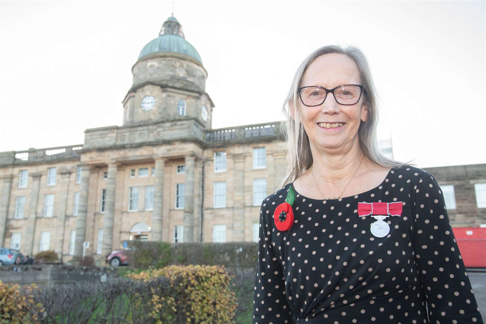 Liz Tait proudly wears her British Empire Medal outside Dr Gray's Hospital. Picture: Daniel Forsyth.