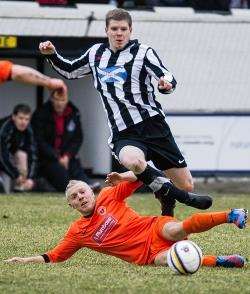 Ross Allan attempts to hurdle the challenge of Fort defender Darren Duncan.