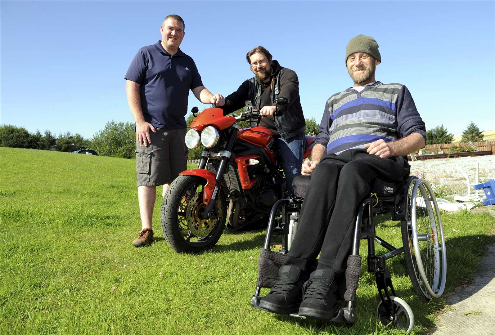 Iain Ogston [right] from Mulben with nephew Chris Stuart [standing] and biker Chris Macdonald. Picture: Eric Cormack