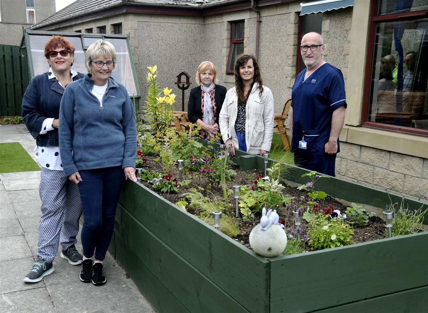 Admiring the new raised flower bed are (from left) Friends members Christine Allan, Rhonda McIntosh and Lesley Davidson, Freinds chairwoman Megan Walls and Glen Erskine, senior charge nurse at Muirton Ward. Picture: Beth Taylor