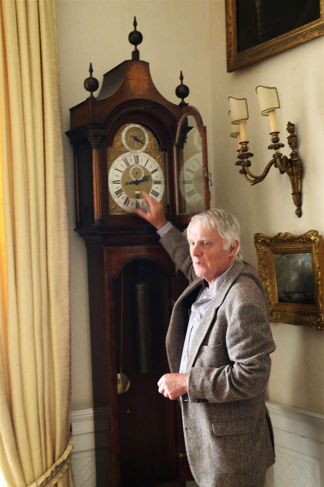 Dr Chris Edwards with the clock at Leith Hall.