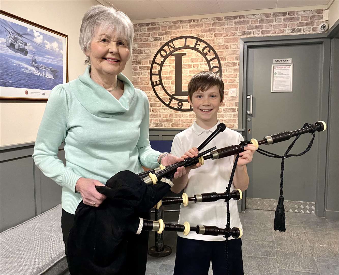 Elizabeth Cameron presented the bagpipes to Ruaridh Gault. Picture: Phil Harman