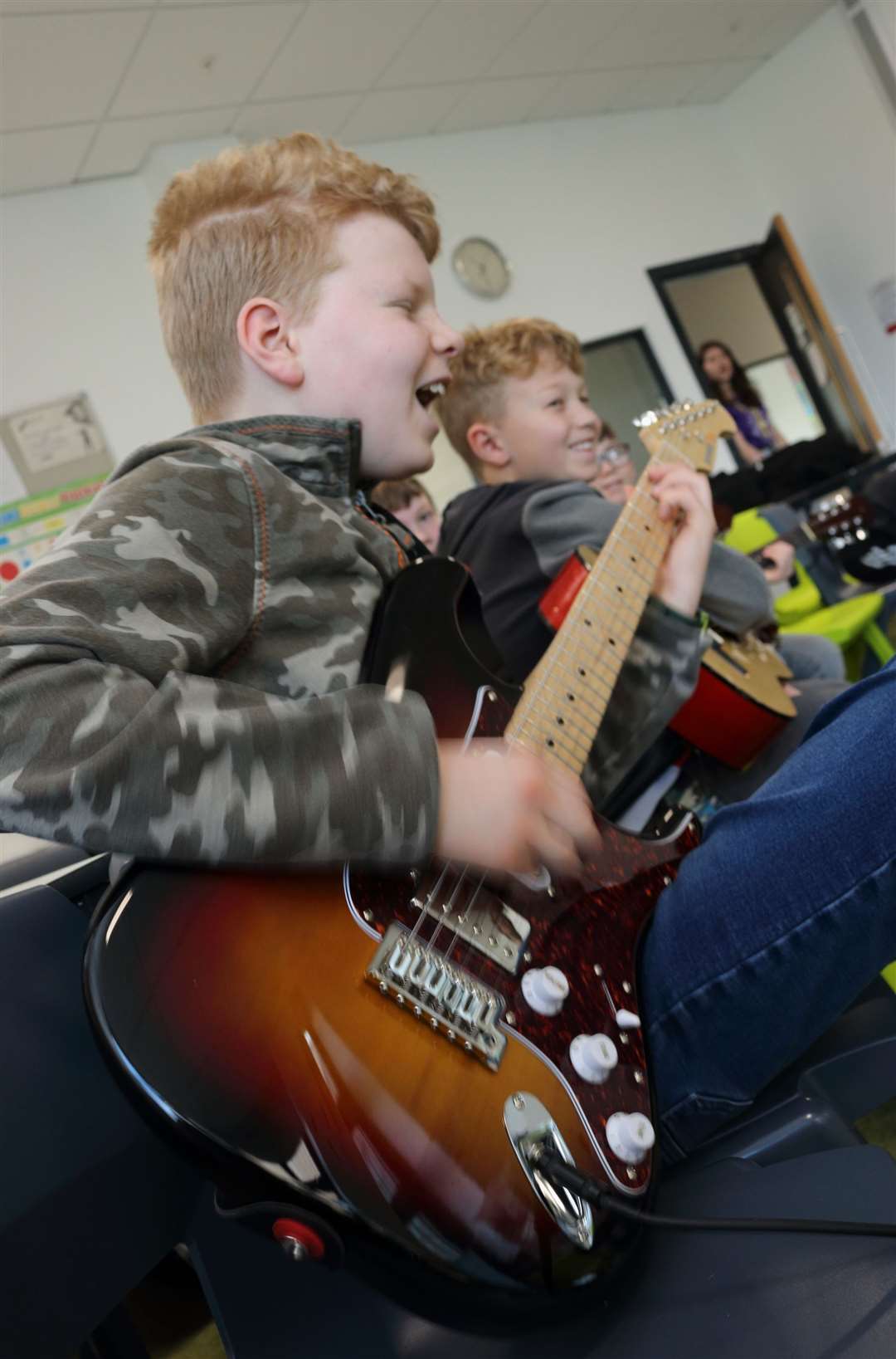 Rocking it out in the guitar lessons.