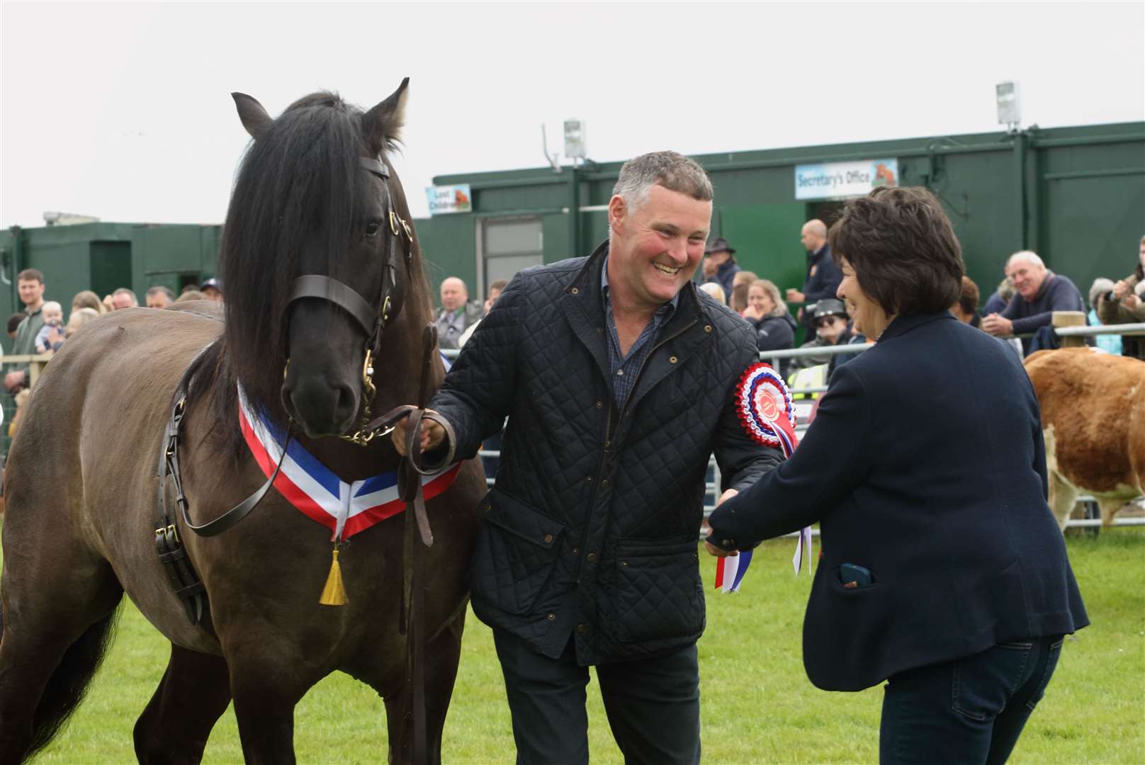 Judge Aileen Ingram congratulates David Smith, handler for Champion of Champions Trailtrow Teviot from Fiona Menzies, Insch. Pictiure: David Porter