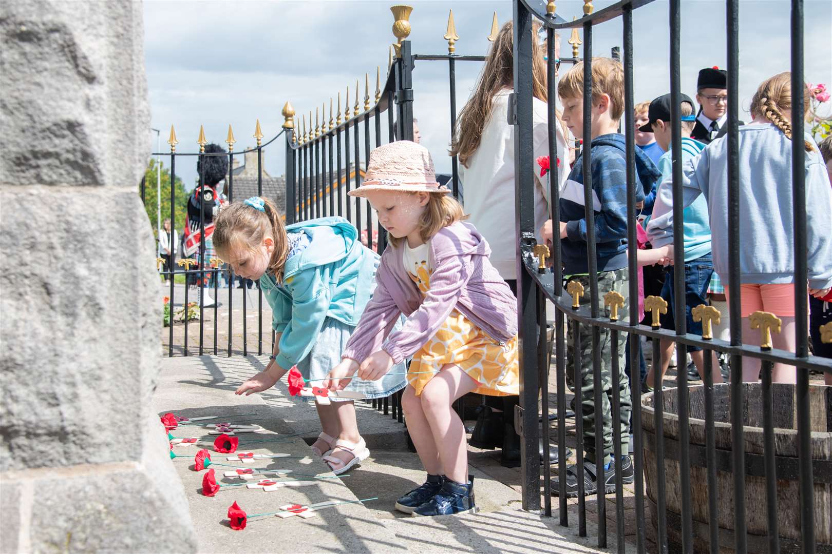 Local children were invited up to lay a poppy at the memorial..Picture: Daniel Forsyth..