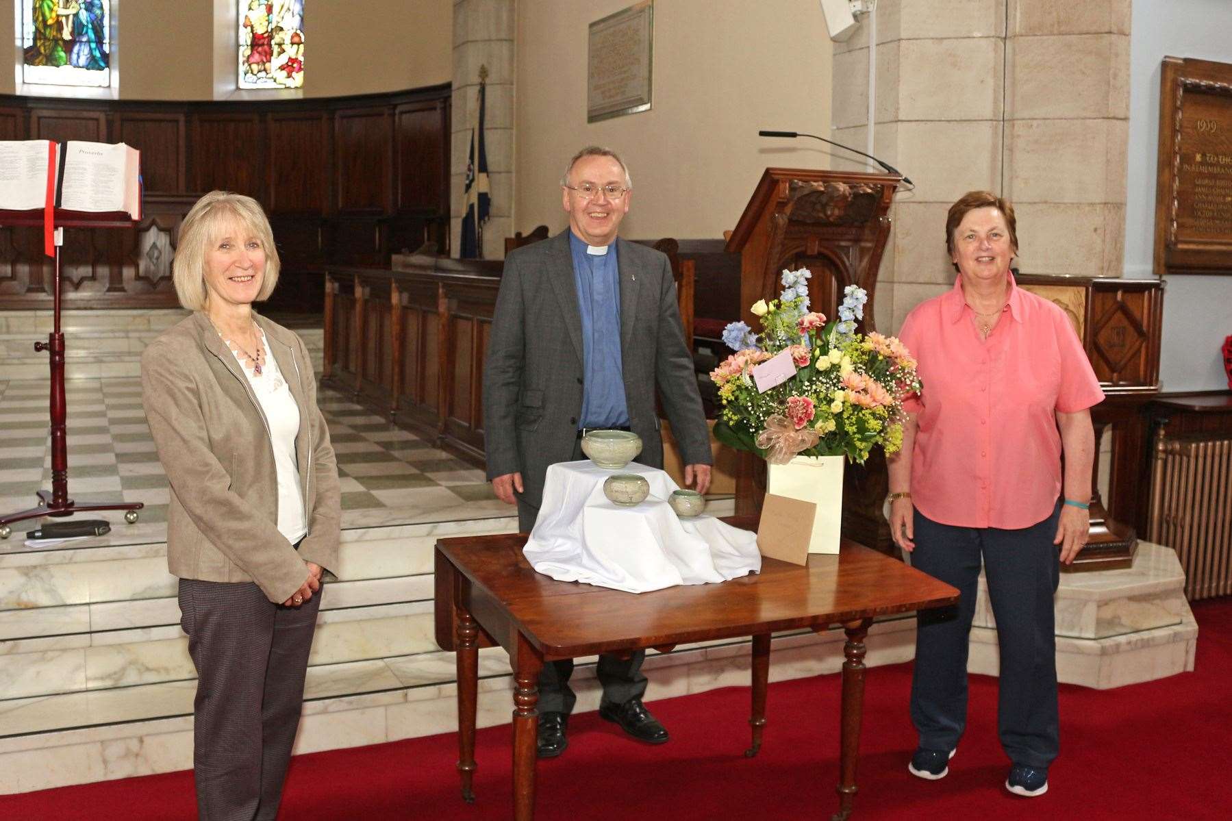 Banff Parish Church secretary Janet Simpson, Rev David Locke and session clerk Margaret Henderson at the presentation during the minister's final service. Picture: Andrew Taylor