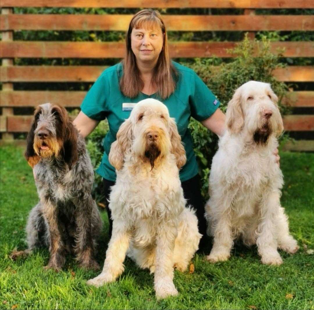 Vet nurse assistant Sharon Burrows with three of her dogs Abra, Sorrel and Fera.