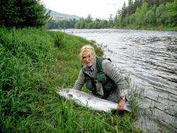 Accomplished angler Jean Marshall, a qualified casting instructor, is pictured with the stunning 29lb salmon she caught on the River Deveron last year