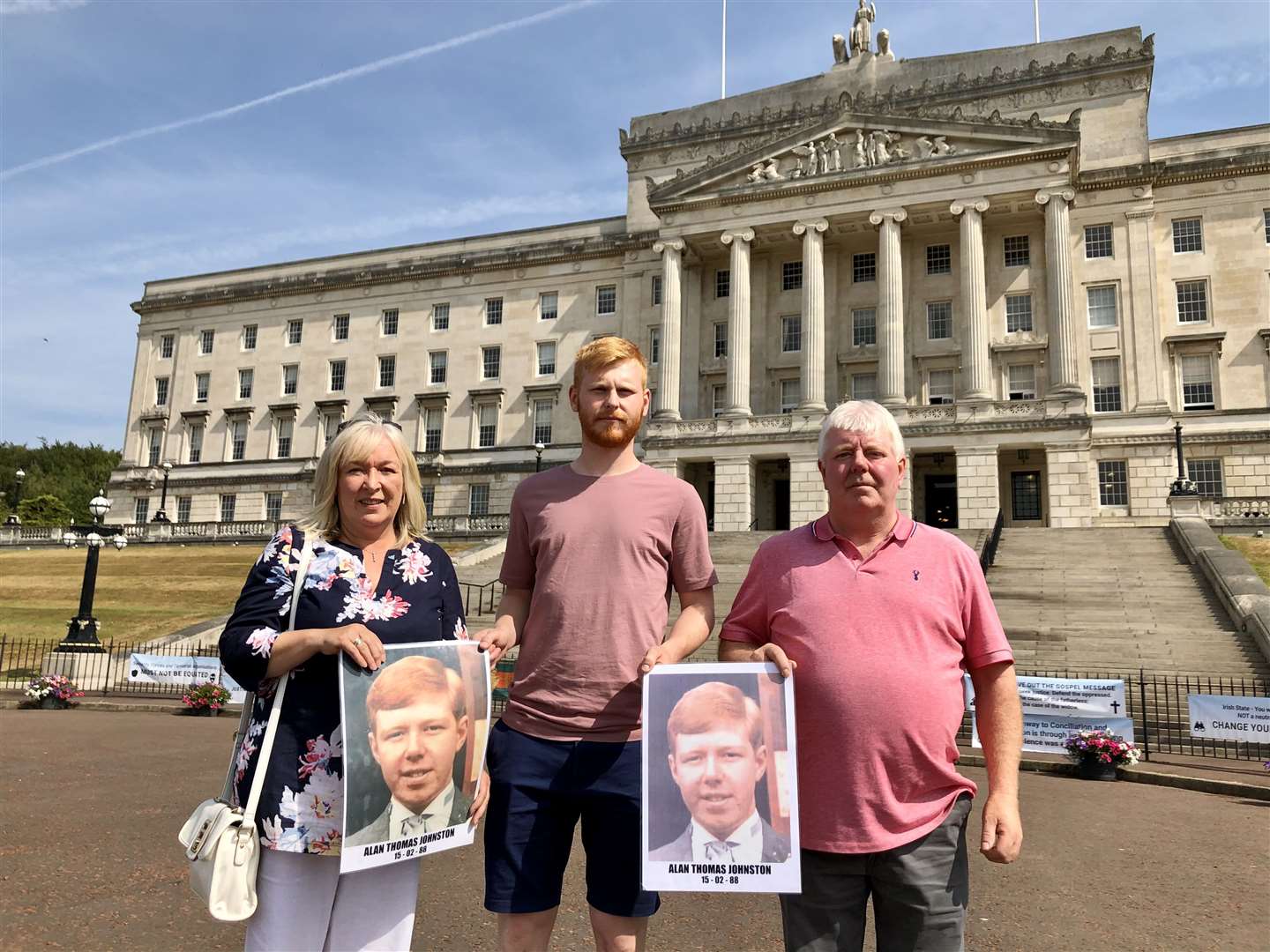 Sandra Harrison and Ian Johnston hold pictures of their murdered brother Alan Johnston. Joining them is Ian’s son who was named Alan after his uncle (David Young/PA)