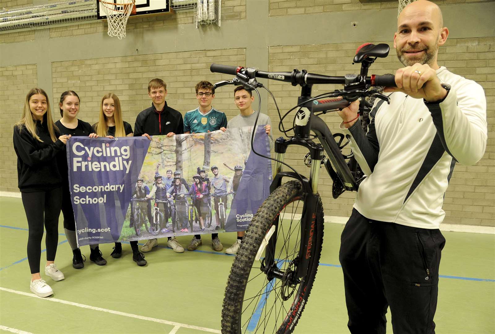 Stefan Wojcik, joined pre-lockdown by some bike enthusiast students, celebrates BCHS's Cycling Friendly award. Picture: Eric Cormack