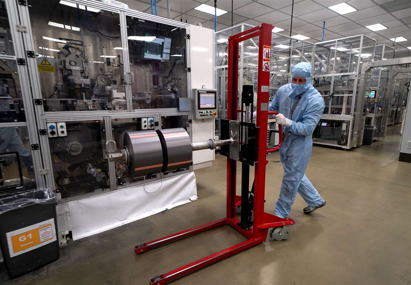 A worker moves components used in the manufacture of the battery for the Nissan Leaf at the Envision AESC UK Ltd battery plant based at Nissan in Sunderland (Owen Humphreys/PA)