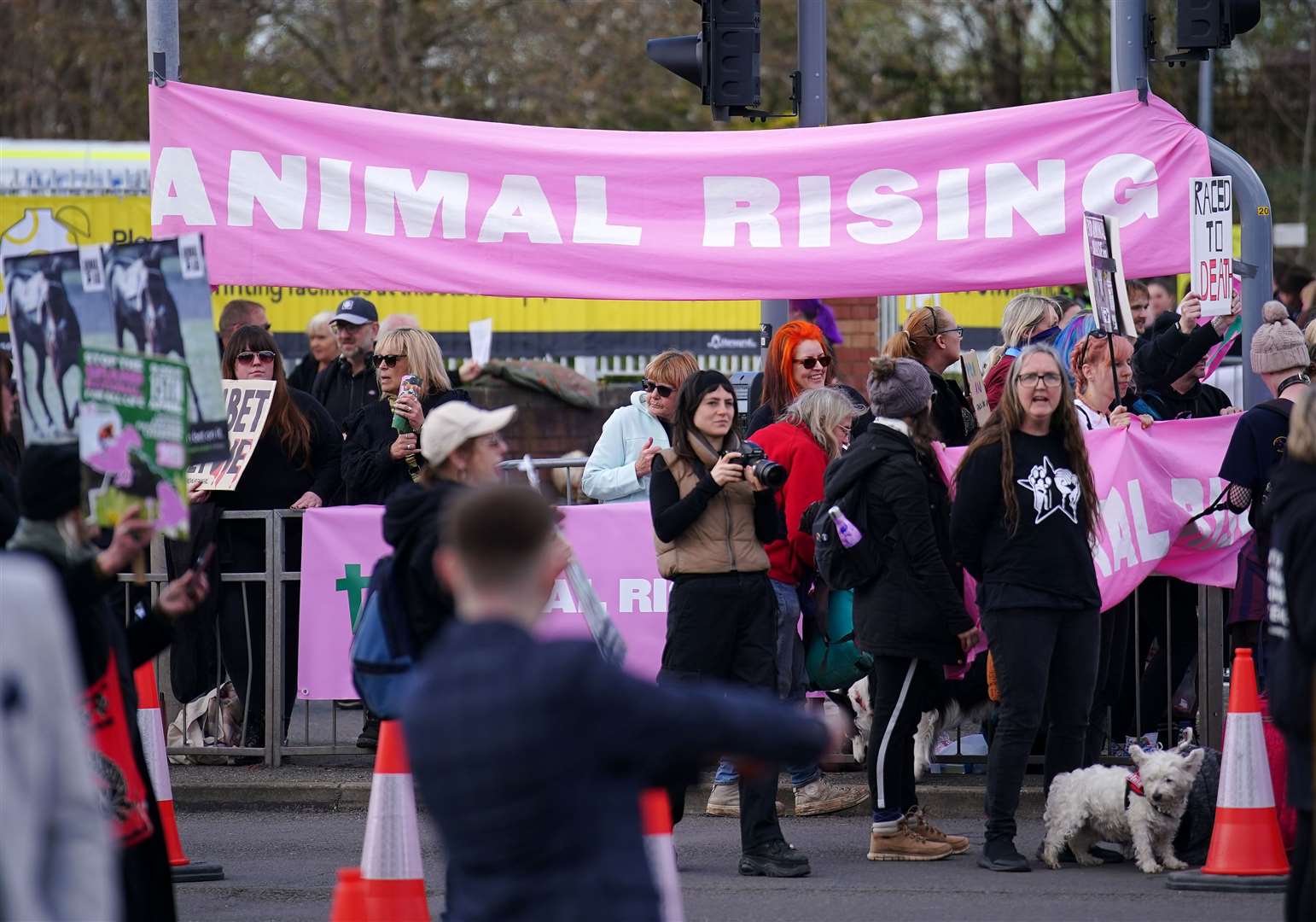 Animal Rising activists outside the gates ahead of day three of the Randox Grand National Festival at Aintree Racecourse (PA)