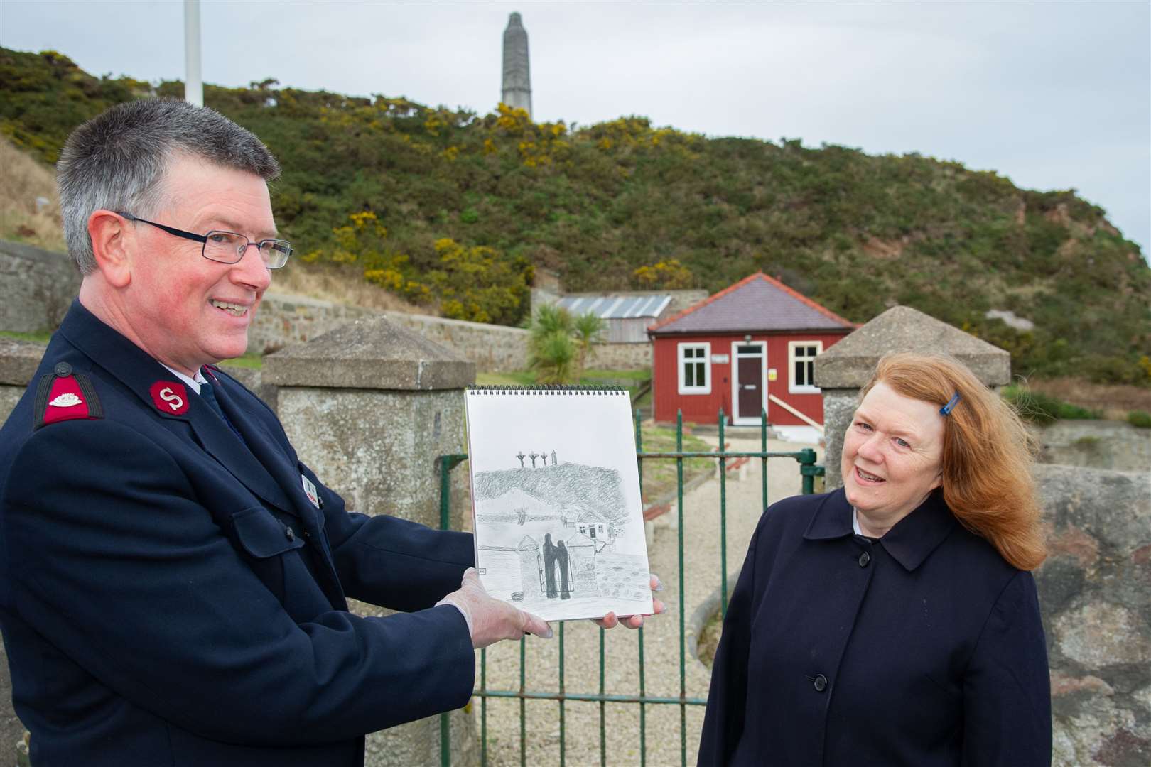 Salvation Army Majors Bruce and Isobel Smith with some of the 15 Journey to Hope sketches next to the bowling club, one of the locations. Picture: Daniel Forsyth