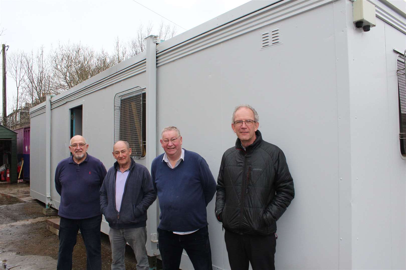 Members of Ellon and District Men's Shed outside the new portable building.