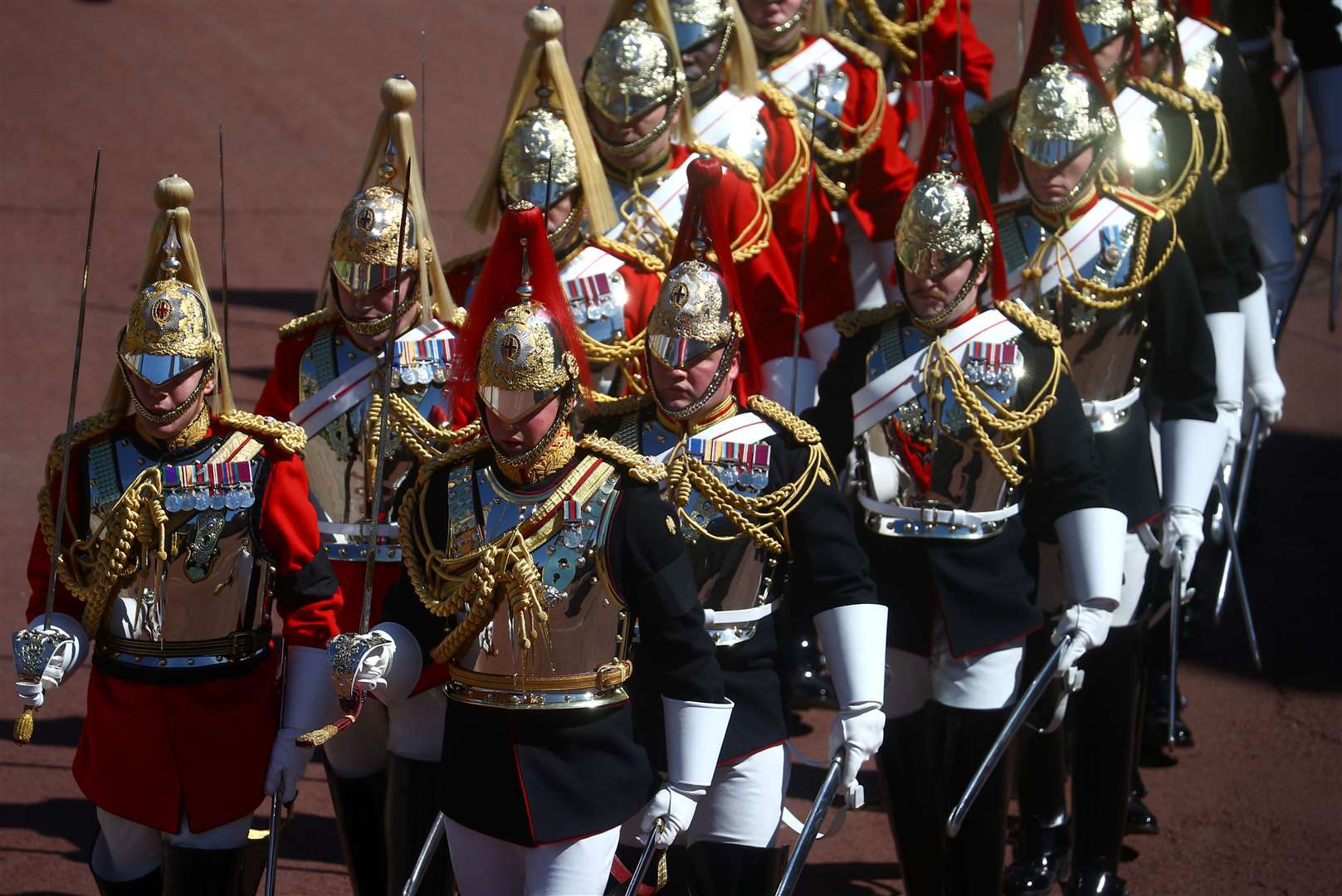 Members of the household cavalry march outside St George’s Chapel ahead of the funeral (Hannah McKay/PA)