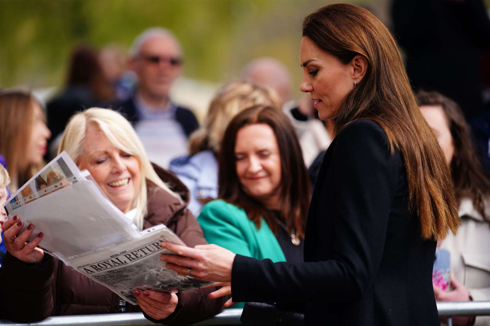 The Princess of Wales speaks to onlookers during her visit to the Aberfan memorial garden (Ben Birchall/PA)